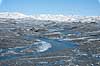 Indlandsisen. En smeltevandsflod snor sig hen over indlandsisen. N�r Russel gletscheren p� Gr�nland.  Kangerlussuaq Gr�nland   S�ndre Str�mfjord, landskaber, indlandsis, smeltevand, afsmeltning, global opvarmning, gletcher, gletsjer, gletscher, br�, is-br�, skri�j�kull, j�kel, glacier