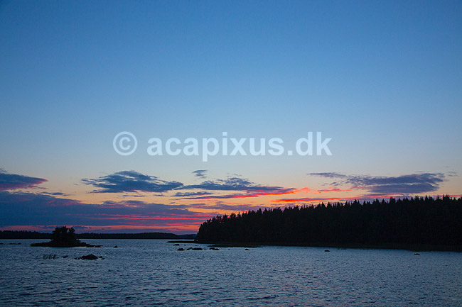 Solnedgang. Solen g�r ned over �snen s�en; ; Lake �snen; Sverige; ; ; Solnedgange