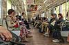 Togrejsende. Japanske togpassagerer i  tog p� vej imellem Kyoto og Nara  Kyoto Japan Asien  tog, transport, pendling, rejse, pendlere, jernbaner