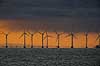Solopgang bag Aflandshage Vindm�llepark. Aflandshage  havvindm�llepark med solopgang i baggrunden set fra Drag�r Fort  Drag�r Danmark   Vindm�lle, vindenergi, energi, str�m, gr�n energi, offshore wind farm HOFOR